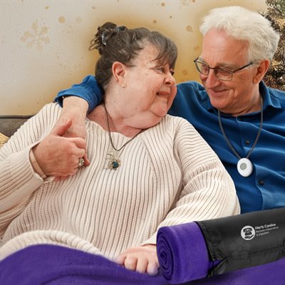 Couple sitting with a blanket