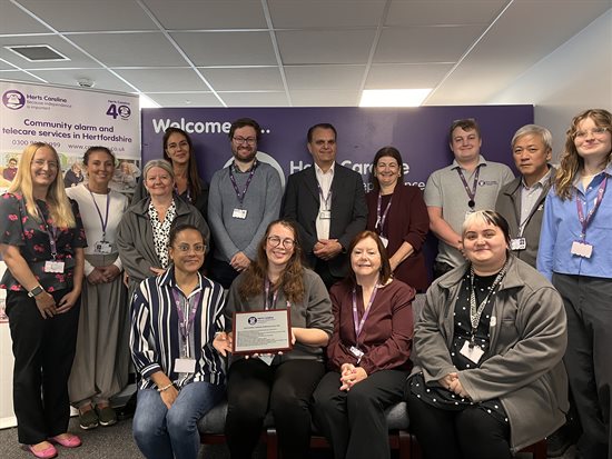 Herts Careline Team posing with awards plaque