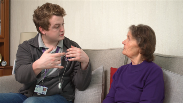 Technichan handing pendant to customer