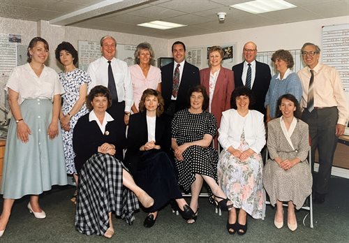 Careline team posing for a team photo in their control room in 1992