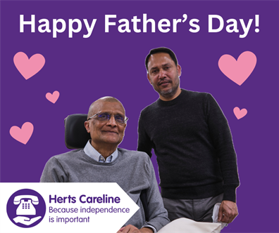 A father sat in a chair with his son standing next to him